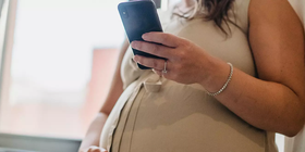 pregnant lady on mobile phone.webp