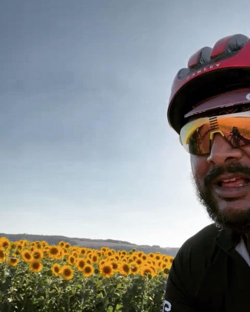 Cycling past sunflower field.png