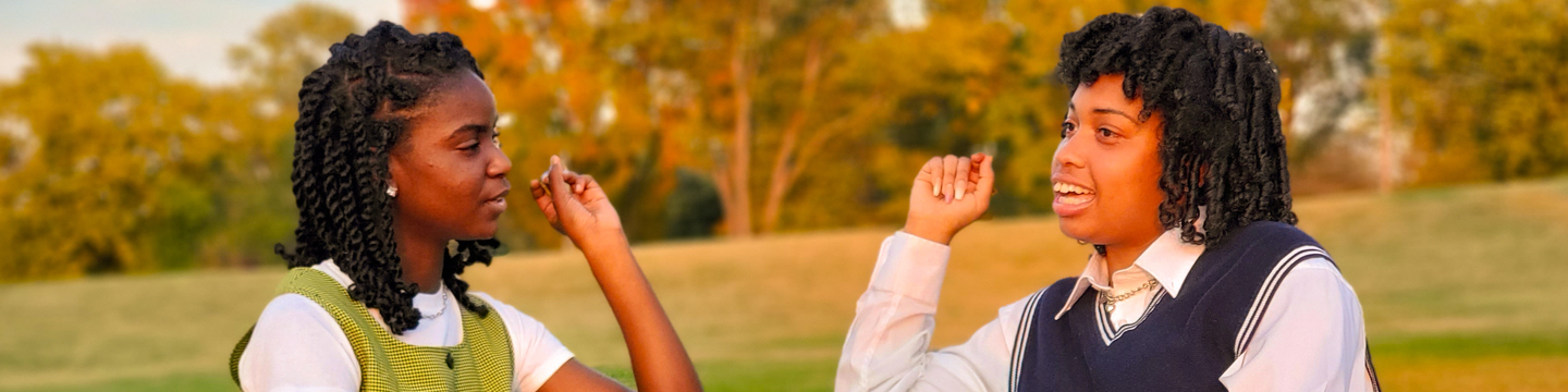 two young women talking.png